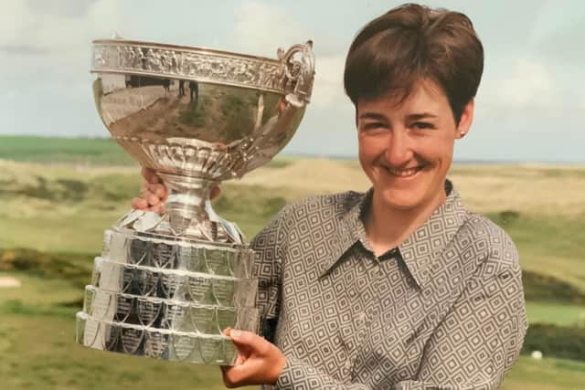Alison Davidson shows off the Women's Amateur Championship Trophy after he success at Cruden Bay in 1997.