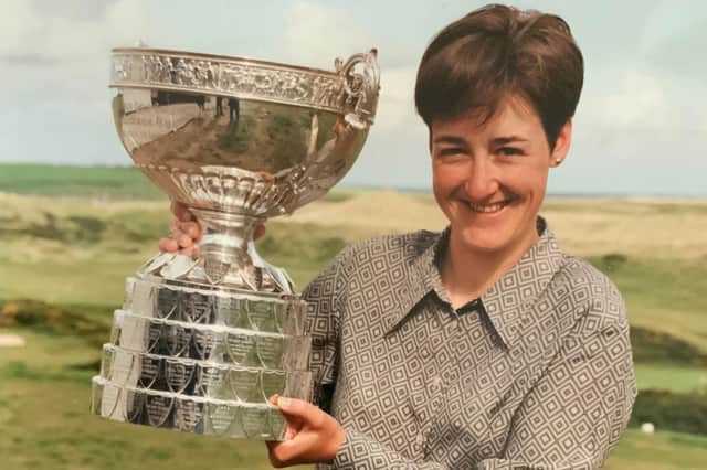 Alison Davidson shows off the Women's Amateur Championship Trophy after he success at Cruden Bay in 1997.