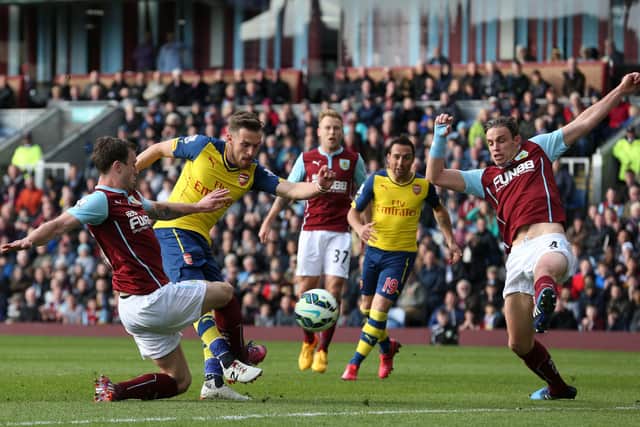 Scott Arfield (centre) looks on as Aaron Ramsey (second left) scores the winning goal for Arsenal against Burnley at Turf Moor in April 2015. (Photo by Lindsey Parnaby/AFP via Getty Images)