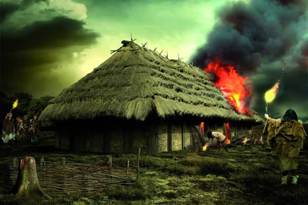 A reconstruction of the great fire at the Neolithic hall on Doon Hill in East Lothian which may have been deliberately started to create a "spectacle" in the landscape. PIC: HES.