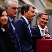 Chancellor of the Exchequer Jeremy Hunt leaves 11 Downing Street, London, with his ministerial box and members of his ministerial team before delivering his Budget at the Houses of Parliament. Picture: Victoria Jones/PA Wire