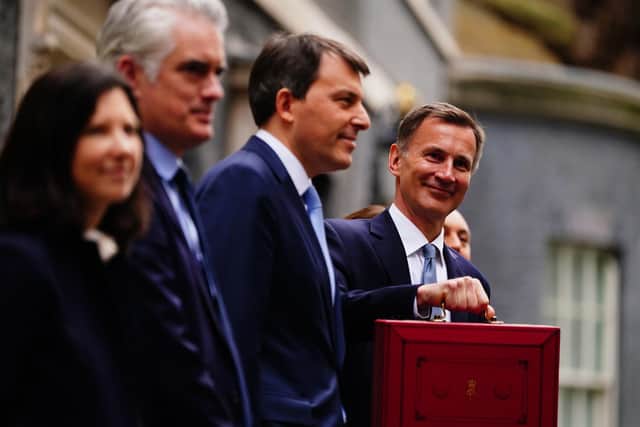 Chancellor of the Exchequer Jeremy Hunt leaves 11 Downing Street, London, with his ministerial box and members of his ministerial team before delivering his Budget at the Houses of Parliament. Picture: Victoria Jones/PA Wire