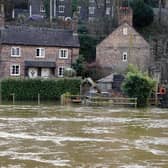 The Vic Haddock boat house (right) is flooded along the swollen River Severn (Pic: Nick Potts/PA Wire)