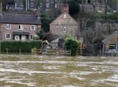 The Vic Haddock boat house (right) is flooded along the swollen River Severn (Pic: Nick Potts/PA Wire)