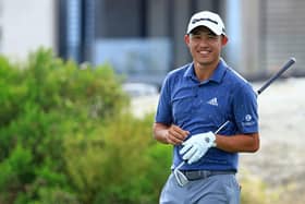 Collin Morikawa smiles after chipping in for an eagle at the third in the third round of the Hero World Challenge at Albany Golf Course in Nassau. Picture: Mike Ehrmann/Getty Images.