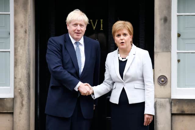 Nicola Sturgeon and Boris Johnson are political opponents, but they need to work together for the good of the country (Picture: Duncan McGlynn/Getty Images)