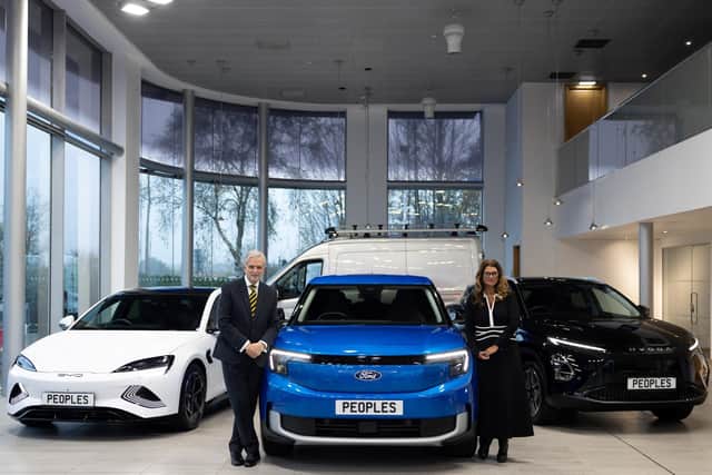 Brian Gilda, chairman, and Nicola Gilda, managing director, with some of the vehicles that Peoples sells.