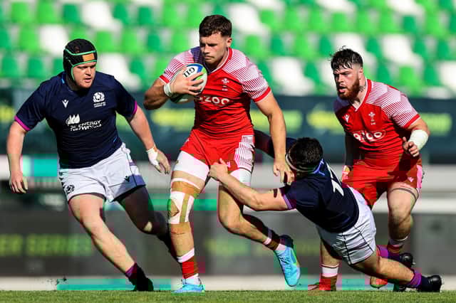 Scotland's Iain Carmichael tackles Wales' Mason Grady during the 45-15 defeat. Pic: ©INPHO/Ben Brady