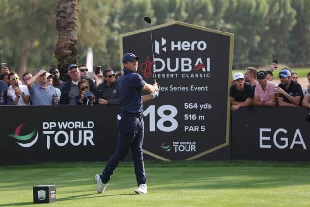 Rory McIlroy tees off on the 18th hole at Emirates Golf Club in the second round of Hero Dubai Desert Classic. Picture: Warren Little/Getty Images.