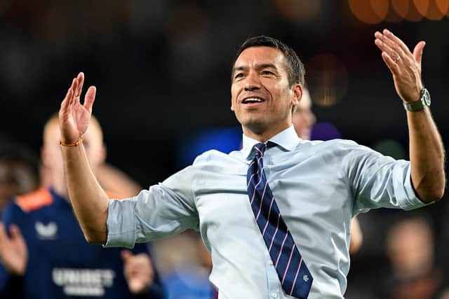 Giovanni van Bronckhorst celebrates Rangers' victory against PSV Eindhoven.