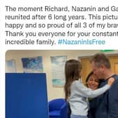 Screen grab from the Twitter feed of Tulip Siddiq @TulipSiddiq of Nazanin Zaghari-Ratcliffe being reunited with her husband Richard Ratcliffe and their daughter Gabrielle at RAF Brize Norton in Oxfordshire.