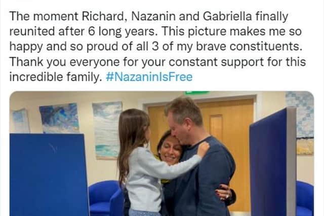Screen grab from the Twitter feed of Tulip Siddiq @TulipSiddiq of Nazanin Zaghari-Ratcliffe being reunited with her husband Richard Ratcliffe and their daughter Gabrielle at RAF Brize Norton in Oxfordshire.