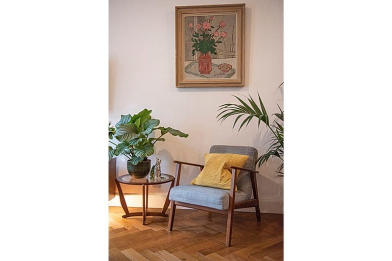 Plants and paintings add colour and character to the property's interior.