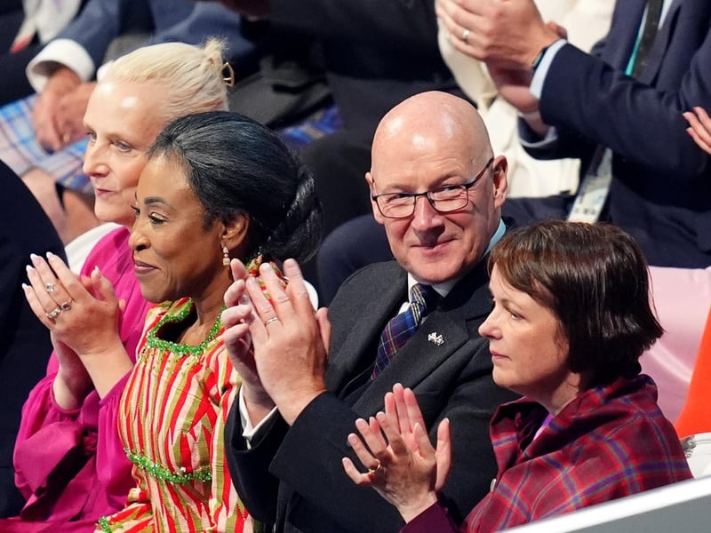 First Minister John Swinney alongside his wife Elizabeth Quigley during the opening ceremony