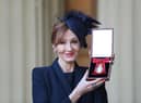 SNP leadership candidates were asked in a TV debate whether they thought JK Rowling, seen with her Companion of Honour medal, was a 'national treasure' (Picture: Andrew Matthews/WPA pool/Getty Images)