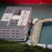 Workers leave the Bibby Stockholm accommodation barge at Portland Port in Dorset, during what is believed to be a fire drill