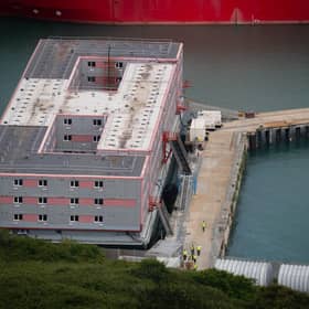 Workers leave the Bibby Stockholm accommodation barge at Portland Port in Dorset, during what is believed to be a fire drill