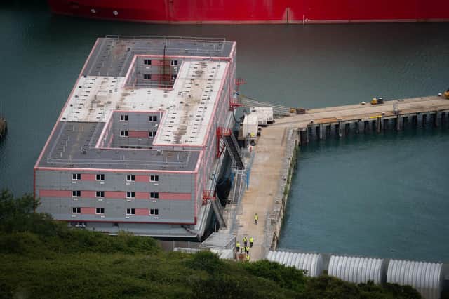 Workers leave the Bibby Stockholm accommodation barge at Portland Port in Dorset, during what is believed to be a fire drill