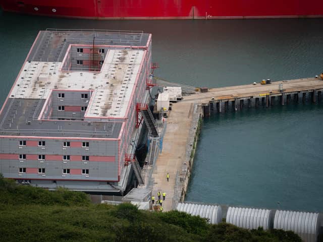 Workers leave the Bibby Stockholm accommodation barge at Portland Port in Dorset, during what is believed to be a fire drill