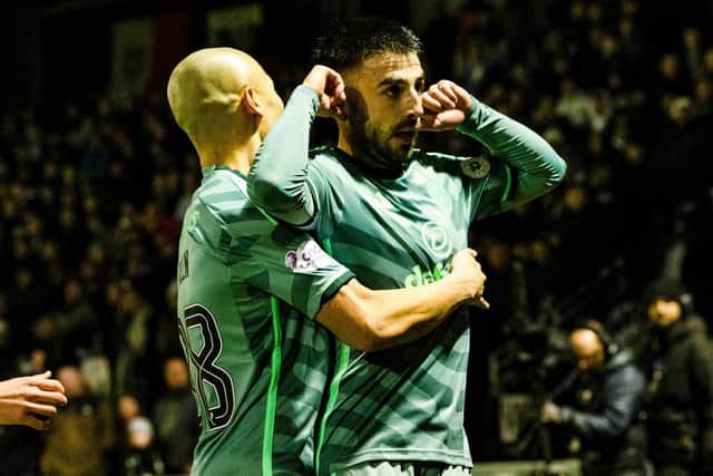 Celtic's Greg Taylor celebrates with Daizen Maeda after scoring to make it 3-0 over St Mirren. (Photo by Craig Foy / SNS Group)