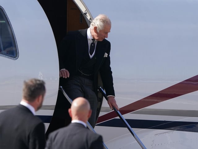 King Charles III arrives at Edinburgh Airport after travelling from London with the Queen Consort, ahead of joining the procession of Queen Elizabeth's coffin from the Palace of Holyroodhouse to St Giles' Cathedral, Edinburgh.