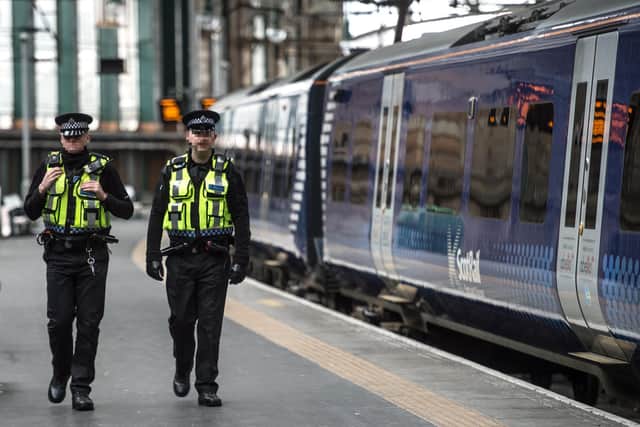 British Transport Police - pictured patrolling Glasgow Central Station pre-Covid - said violent incidents on the rail network remained rare. Picture: John Devlin