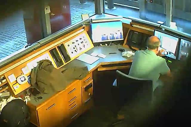 David Smith taking video of CCTV monitors in the British Embassy