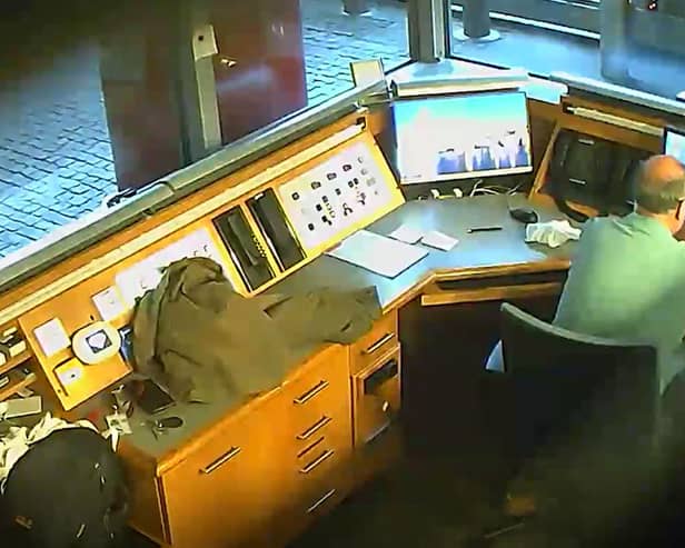 David Smith taking video of CCTV monitors in the British Embassy