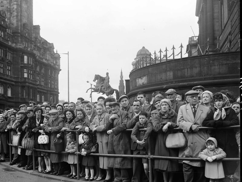 Crowds wait to see the May Day Parade at the east end of Princes Street outside Register House in 1963.