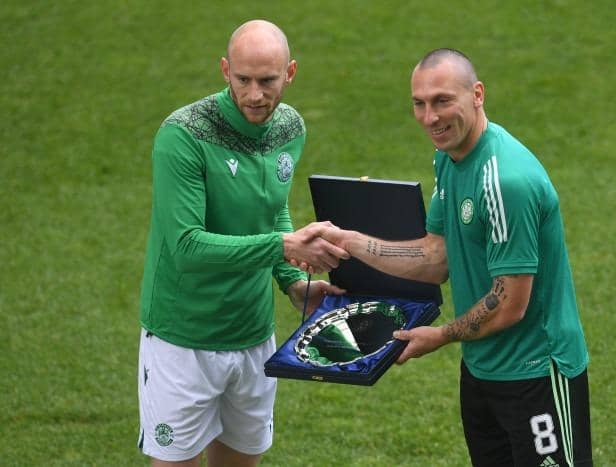 David Gray presents Scott Brown with a gift on his last Celtic appearence, which came against Hibs at Easter Road on May 2021. (Photo by Craig Foy / SNS Group)