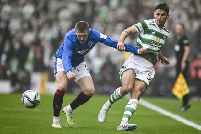 Celtic's Matt O'Riley passes the ball away from John Lundstram during the 1-0 Scottish Cup win over Rangers.