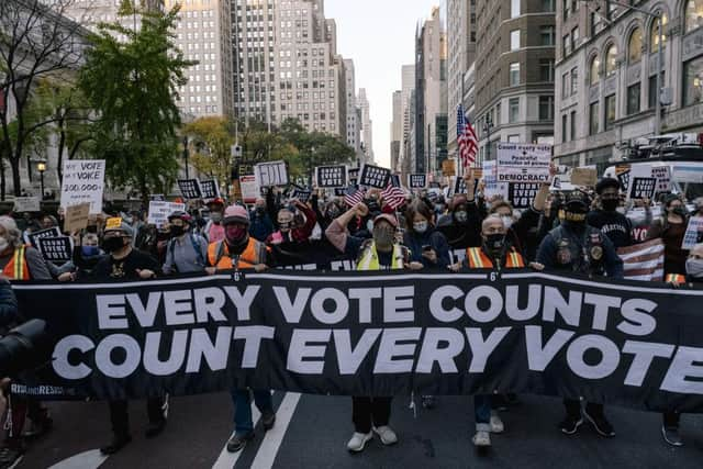 Voters in both camps, though particularly Democrats, are demanding that every vote is counted (Getty Images)