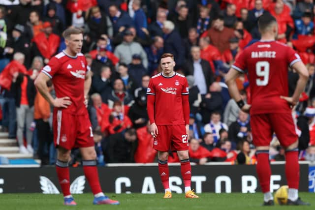 Aberdeen defender David Bates (centre) reacts after Rangers take the lead at Ibrox.  (Photo by Craig Williamson / SNS Group)
