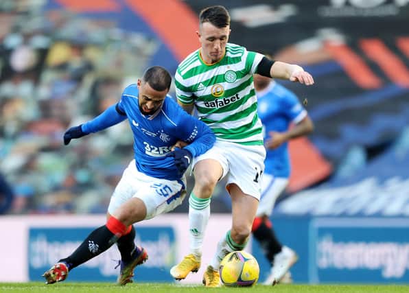 Celtic's David Turnbull (and Rangers' Kemar Roofe tussle in the January derby at Ibrox - now Eddie Howe could face two such monster assignments in his opening month. (Photo by Craig Williamson/SNS Group).