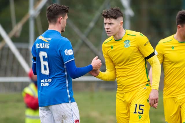 Hibs' Kevin Nisbet with Connor McManus at full time during the Scottish Cup tie between Stranraer and Hibs.