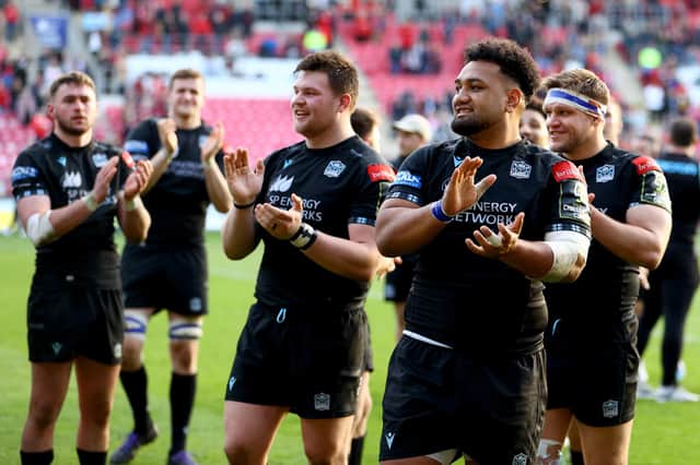 Sione Vailanu applauds the small band of travelling Glasgow Warriors supporters after the Euro semi-final win over Scarlets. (Photo by Michael Steele/Getty Images)