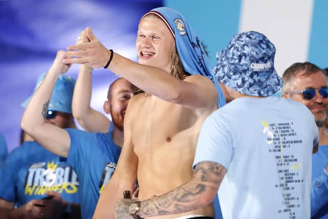 Erling Haaland celebrates during Manchester City's treble parade after the 1-0 win over Inter Milan secured them Champions League glory.