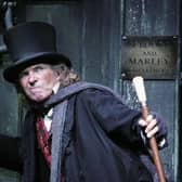 Will the spirit of Ebenezer Scrooge, seen here played by Tommy Steele, be John Swinney's guide when he delivers the Scottish Budget? (Picture: MJ Kim/Getty Images)