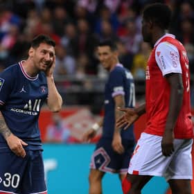 PSG's Argentinian forward Lionel Messi reacts after a challenge from Reims' Zimbabwean midfielder Marshall Munetsi.