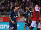 PSG's Argentinian forward Lionel Messi reacts after a challenge from Reims' Zimbabwean midfielder Marshall Munetsi.