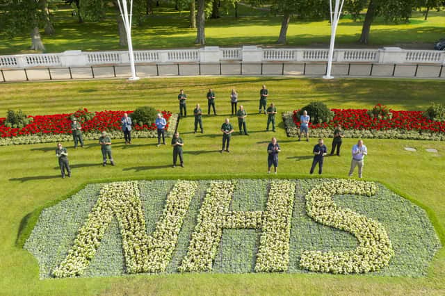 Royal Parks staff applaud the NHS's 72 birthday with a specially created flowerbed in front of Buckingham Palace (Picture: The Royal Parks/Greywolf Studios/PA Wire)