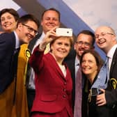 Patrick Grady, right, pictured with Nicola Sturgeon and other newly elected MPs in Glasgow following the 2017 general election (Picture: Andrew Milligan/PA)