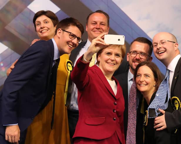 Patrick Grady, right, pictured with Nicola Sturgeon and other newly elected MPs in Glasgow following the 2017 general election (Picture: Andrew Milligan/PA)