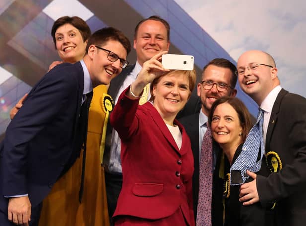 Patrick Grady, right, pictured with Nicola Sturgeon and other newly elected MPs in Glasgow following the 2017 general election (Picture: Andrew Milligan/PA)