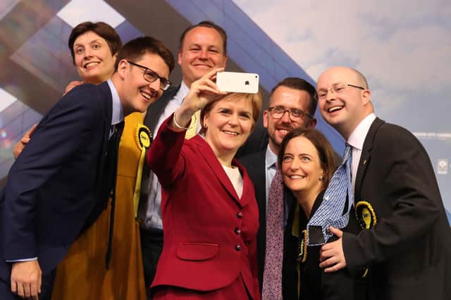 Patrick Grady, right, pictured with Nicola Sturgeon and other newly elected MPs in Glasgow following the 2017 general election (Picture: Andrew Milligan/PA)