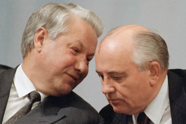 Boris Yeltsin whispers to Mikhail Gorbachev during a session of the People's Congress in Moscow in 1991 (Picture: Vitaly Armand/AFP via Getty Images)