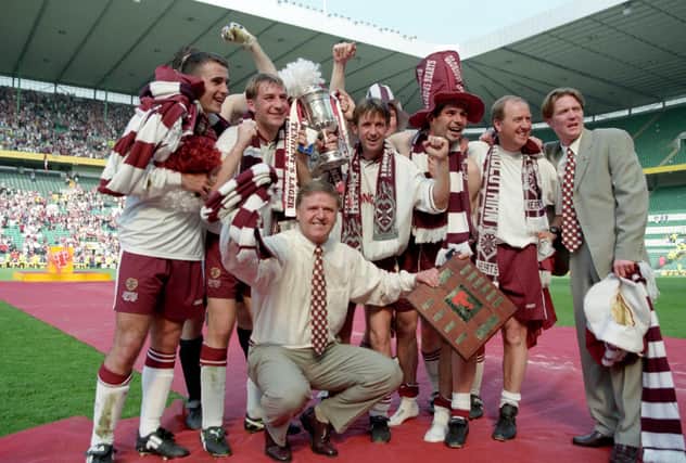 Hearts manager Jim Jefferies and players celebrate winning the 1998 Scottish Cup after a 2-1 win over Rangers at Celtic Park.