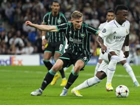Celtic's Carl Starfelt vies for the ball with Real Madrid's Vinicius Junior during the Champions League match at the Bernabeu. (AP Photo/Manu Fernandez)