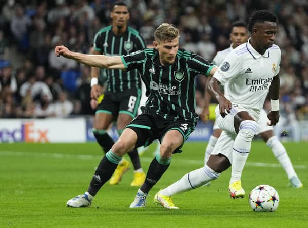 Celtic's Carl Starfelt vies for the ball with Real Madrid's Vinicius Junior during the Champions League match at the Bernabeu. (AP Photo/Manu Fernandez)