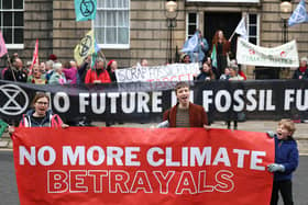 Activists protest outside Bute House last month after the scrapping of a key climate change target (Picture: Jeff J Mitchell/Getty Images)